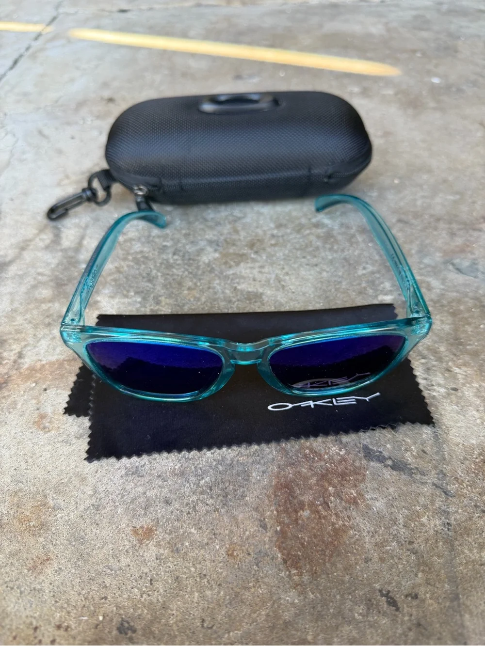 Oakley Teal Translucent Frame Sunglasses with Vibrant Blue Polarized Lenses